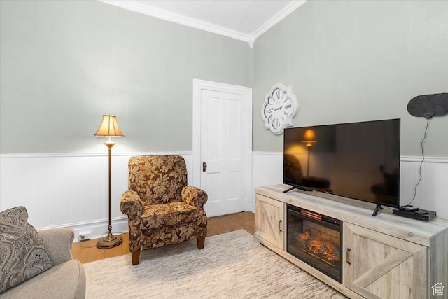 interior space with light hardwood / wood-style flooring and ornamental molding