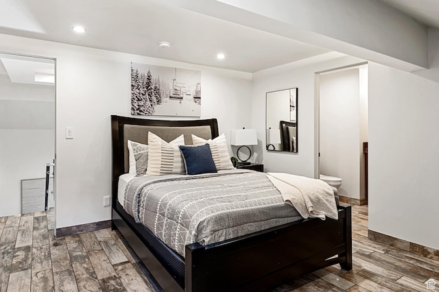 561 S Vasels Rd Unit R16-C, Brian Head, UT 84719 - bedroom featuring ensuite bath, baseboards, wood finished floors, and recessed lighting