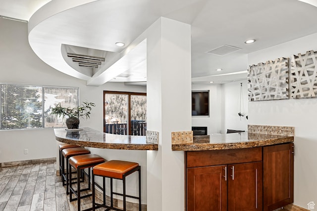 561 S Vasels Rd Unit R16-C, Brian Head, UT 84719 - bar with baseboards, recessed lighting, and light wood-style floors
