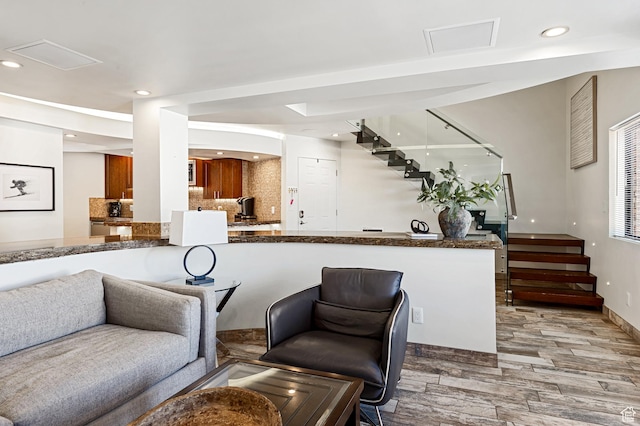 561 S Vasels Rd Unit R16-C, Brian Head, UT 84719 - interior space featuring recessed lighting, backsplash, stairway, and wood finished floors