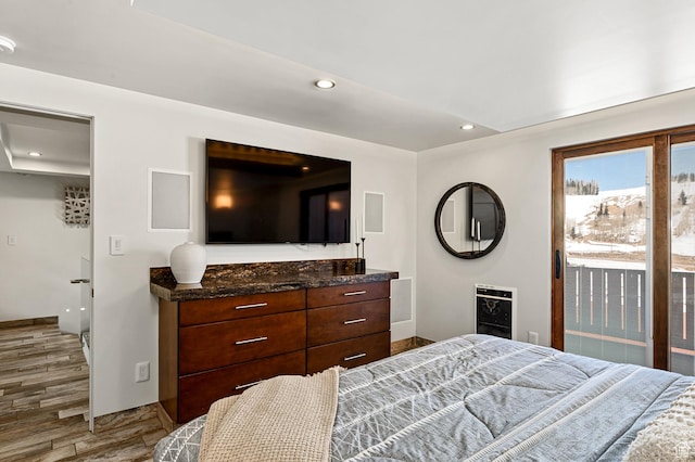 561 S Vasels Rd Unit R16-C, Brian Head, UT 84719 - bedroom with baseboards, heating unit, wood finished floors, and recessed lighting