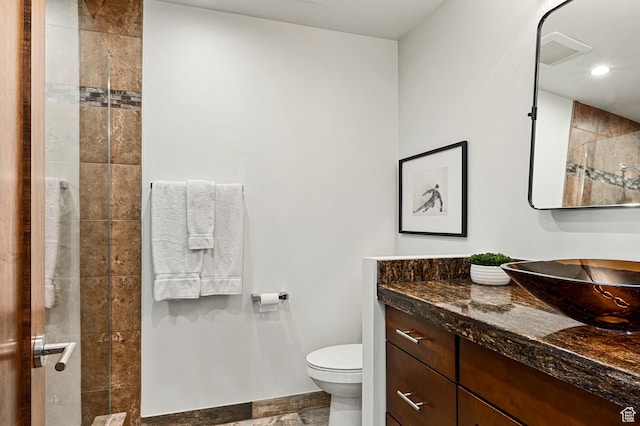 561 S Vasels Rd Unit R16-C, Brian Head, UT 84719 - full bath with visible vents, tiled shower, toilet, vanity, and recessed lighting