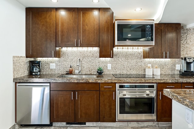 561 S Vasels Rd Unit R16-C, Brian Head, UT 84719 - kitchen featuring a sink, stainless steel appliances, dark brown cabinets, backsplash, and recessed lighting