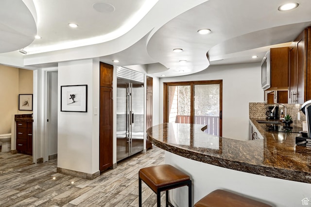 561 S Vasels Rd Unit R16-C, Brian Head, UT 84719 - kitchen with a peninsula, stainless steel built in refrigerator, light wood-style flooring, and recessed lighting