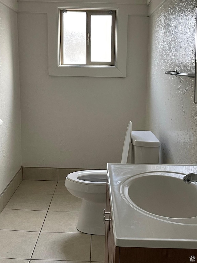 2433 Monroe Blvd, Ogden, UT 84401 - bathroom with baseboards, vanity, toilet, and tile patterned floors