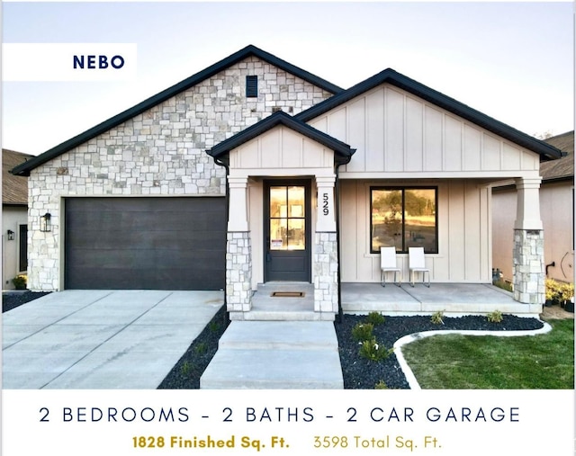 599 N Heritage St W Unit 6, Mapleton, UT 84664 - view of front of property featuring stone siding, board and batten siding, an attached garage, and concrete driveway