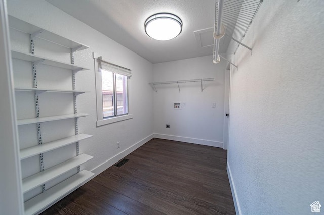 laundry room with dark hardwood / wood-style flooring, washer hookup, and hookup for an electric dryer