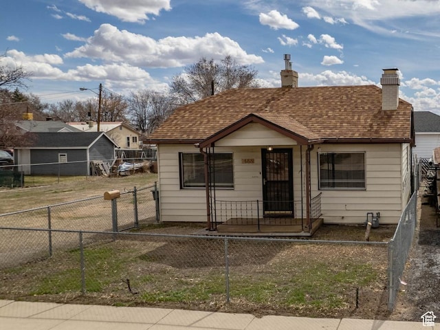 466 E 300 N, Price, UT 84501 - bungalow-style home with a fenced front yard and a chimney