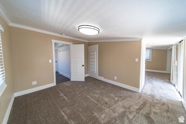 carpeted empty room featuring ornamental molding