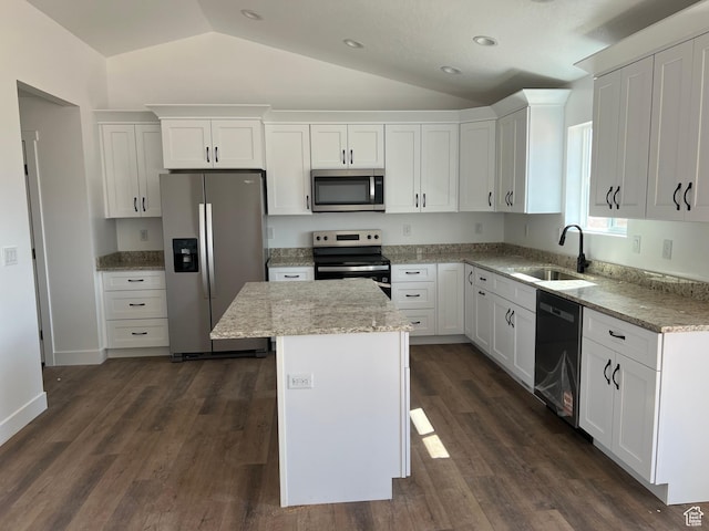 1241 N 3500 E, Ballard, UT 84066 - kitchen featuring a sink, stainless steel appliances, white cabinets, lofted ceiling, and a kitchen island