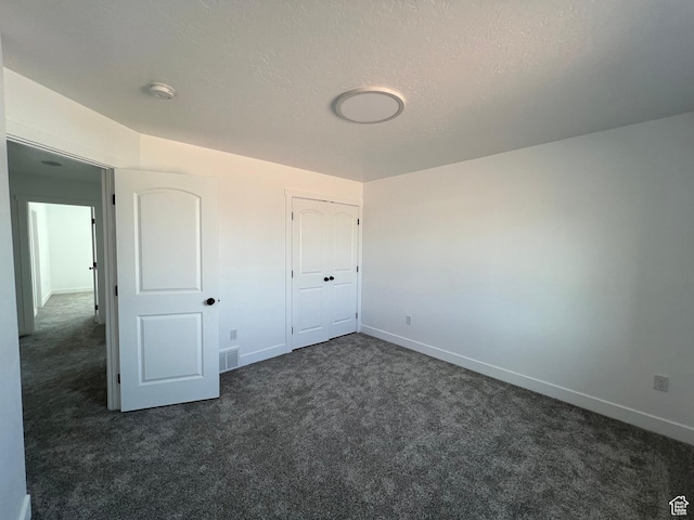 1241 N 3500 E, Ballard, UT 84066 - unfurnished bedroom with baseboards, dark colored carpet, and visible vents