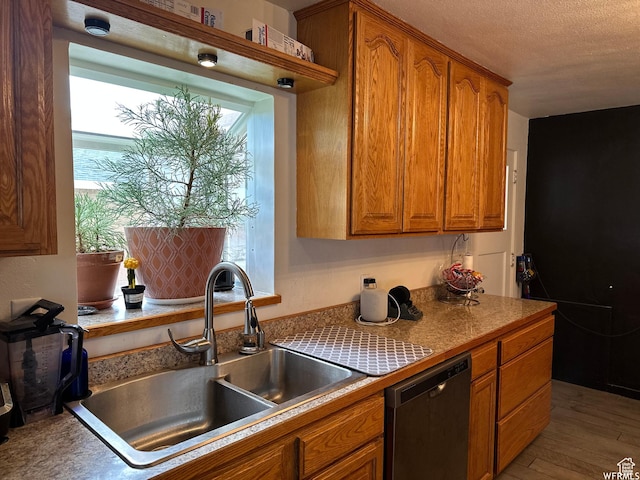 97 N 100 E, Marysvale, UT 84750 - kitchen featuring stainless steel dishwasher, wood-type flooring, sink, and a textured ceiling
