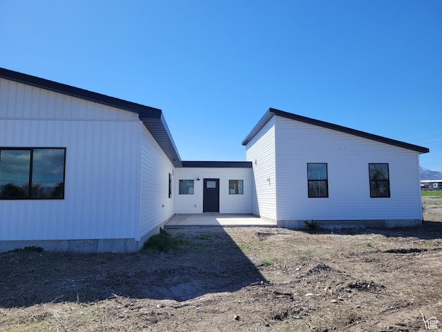 back of house with a patio