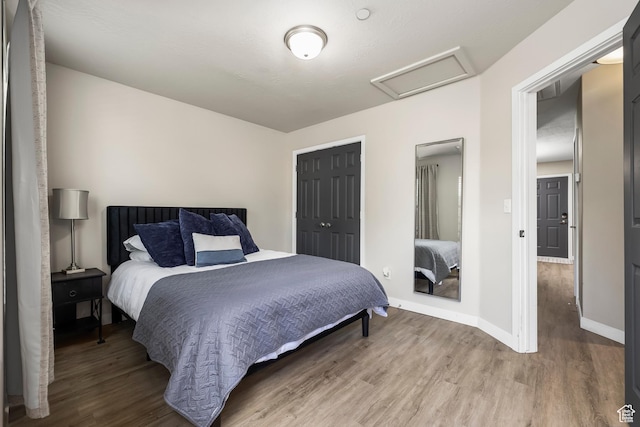 159 E 800 S Unit 208, Salt Lake City, UT 84111 - bedroom featuring wood-type flooring and a closet
