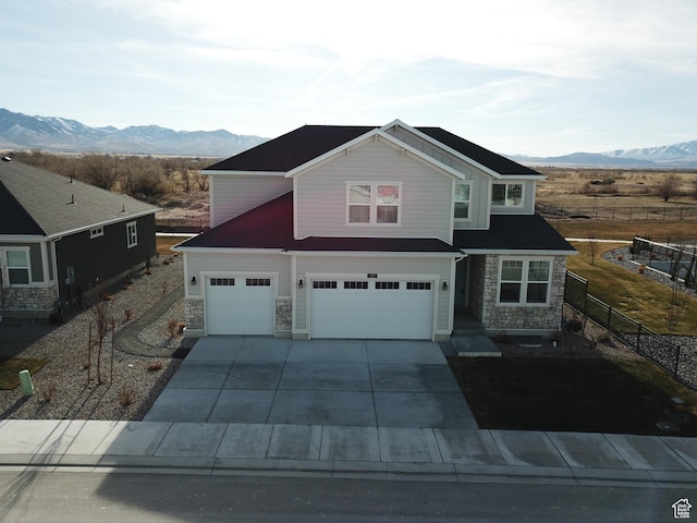 633 W Junegrass Ln, Stansbury Park, UT 84074 - view of front of home with a mountain view and a garage