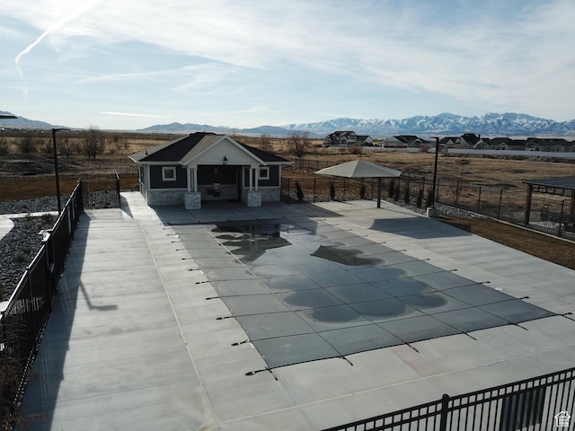 633 W Junegrass Ln, Stansbury Park, UT 84074 - view of pool featuring a mountain view and a patio