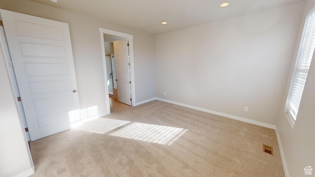633 W Junegrass Ln, Stansbury Park, UT 84074 - unfurnished bedroom featuring light colored carpet