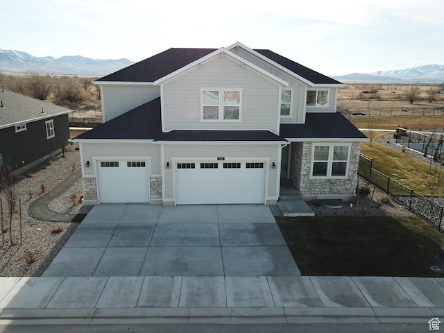 633 W Junegrass Ln, Stansbury Park, UT 84074 - view of front of home featuring a mountain view and a garage
