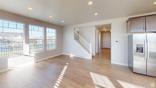 633 W Junegrass Ln, Stansbury Park, UT 84074 - interior space with light hardwood / wood-style floors