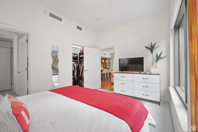 55 W S Temple Unit 204, Salt Lake City, UT 84101 - bedroom featuring a spacious closet, a closet, and visible vents