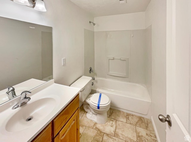 full bathroom featuring bathtub / shower combination, vanity, and toilet