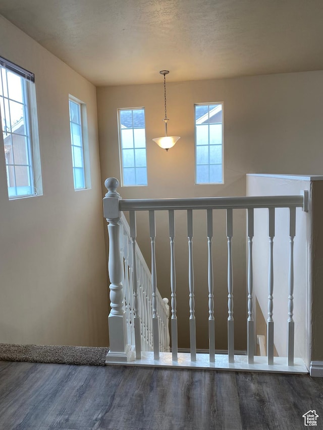 1036 N Darcy Dr W, North Salt Lake, UT 84054 - staircase featuring hardwood / wood-style floors and a textured ceiling