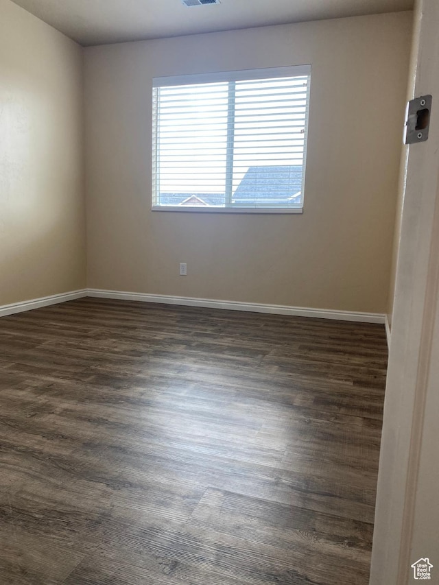 1036 N Darcy Dr W, North Salt Lake, UT 84054 - spare room featuring dark wood-type flooring