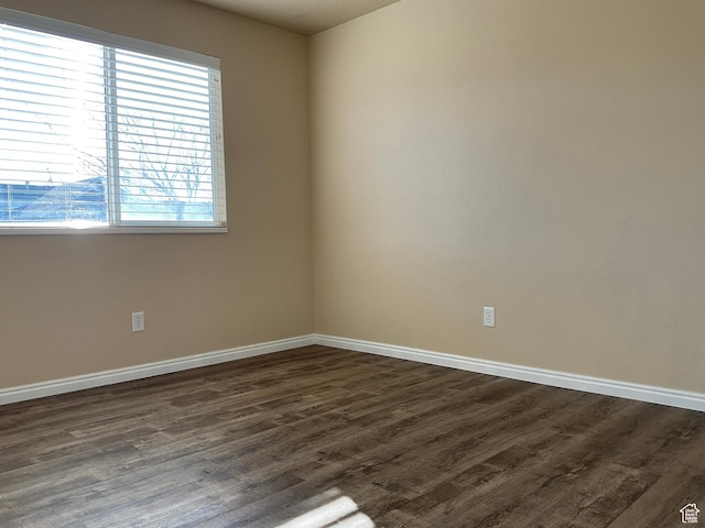 1036 N Darcy Dr W, North Salt Lake, UT 84054 - spare room featuring plenty of natural light and dark wood-type flooring