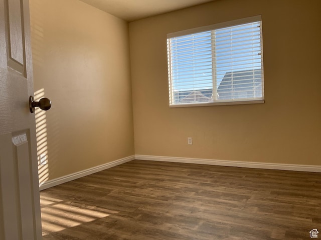 1036 N Darcy Dr W, North Salt Lake, UT 84054 - spare room with dark hardwood / wood-style flooring