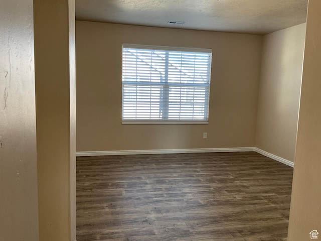1036 N Darcy Dr W, North Salt Lake, UT 84054 - empty room with dark hardwood / wood-style floors and a textured ceiling