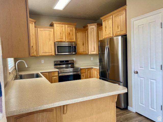 1036 N Darcy Dr W, North Salt Lake, UT 84054 - kitchen with sink, stainless steel appliances, kitchen peninsula, light brown cabinetry, and light wood-type flooring