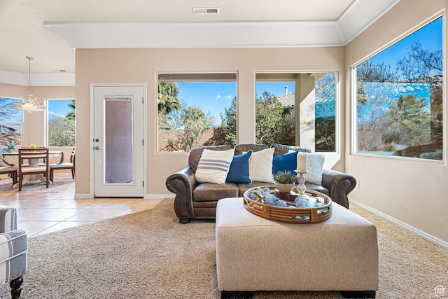 2371 E 2830 S, St George, UT 84790 - tiled living room featuring ornamental molding, an inviting chandelier, and a healthy amount of sunlight