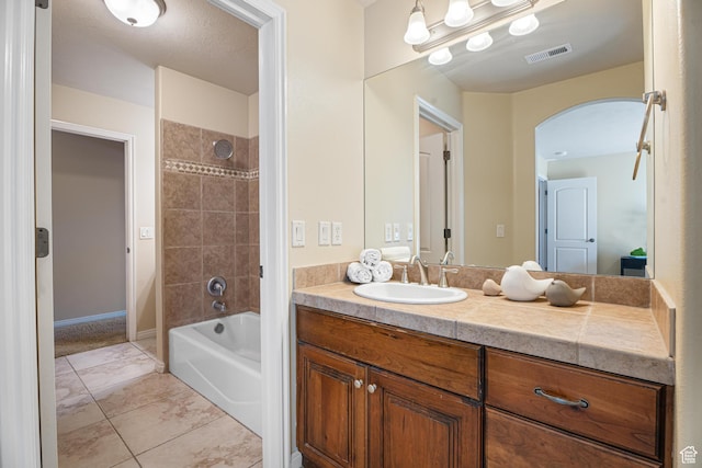 2371 E 2830 S, St George, UT 84790 - bathroom with tile patterned floors, vanity, and tiled shower / bath