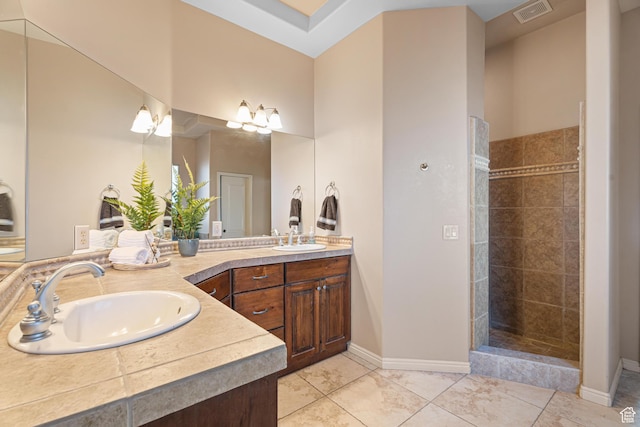 2371 E 2830 S, St George, UT 84790 - bathroom featuring tile patterned flooring, vanity, and tiled shower