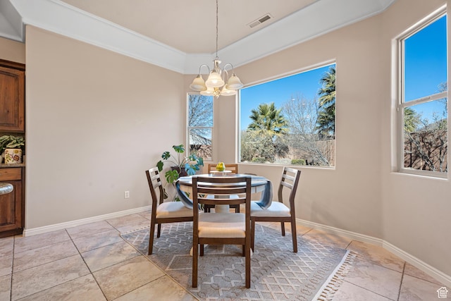 2371 E 2830 S, St George, UT 84790 - dining area featuring a tray ceiling, crown molding, light tile patterned floors, and an inviting chandelier