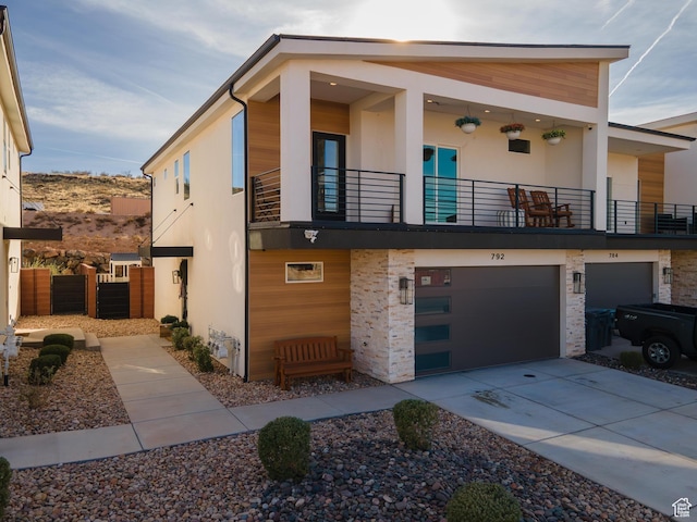 contemporary house with a balcony and a garage