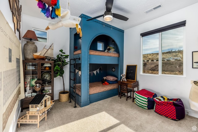 bedroom with ceiling fan and carpet floors