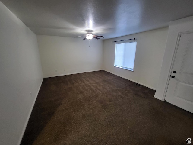 3318 E Quarter Mile Dr, Eagle Mountain, UT 84005 - unfurnished room with ceiling fan, dark colored carpet, and baseboards