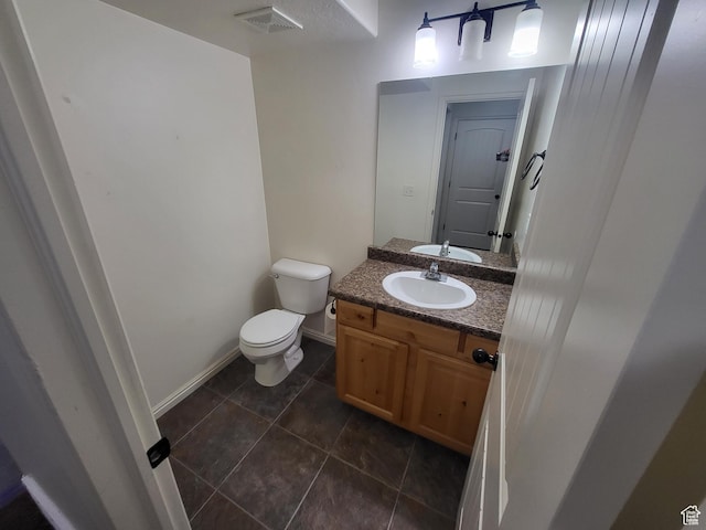 3318 E Quarter Mile Dr, Eagle Mountain, UT 84005 - bathroom with visible vents, toilet, vanity, baseboards, and tile patterned floors