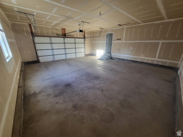 3318 E Quarter Mile Dr, Eagle Mountain, UT 84005 - garage featuring a garage door opener