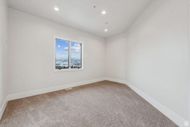 3097 E Corral Peak Cir Unit 145, Heber City, UT 84032 - spare room with baseboards, recessed lighting, and carpet flooring