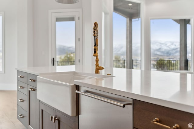 3097 E Corral Peak Cir Unit 145, Heber City, UT 84032 - kitchen featuring a sink, light countertops, gray cabinetry, and dishwasher