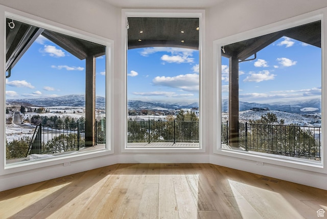 3097 E Corral Peak Cir Unit 145, Heber City, UT 84032 - unfurnished sunroom with a mountain view and wood-type flooring