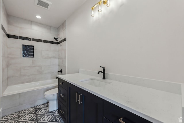 3097 E Corral Peak Cir Unit 145, Heber City, UT 84032 - full bathroom with vanity, tile patterned floors, toilet, visible vents, and tiled shower / bath combo