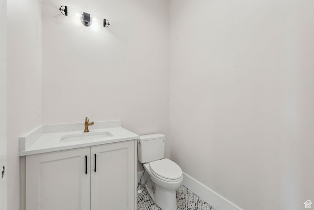3097 E Corral Peak Cir Unit 145, Heber City, UT 84032 - bathroom featuring toilet, vanity, and baseboards