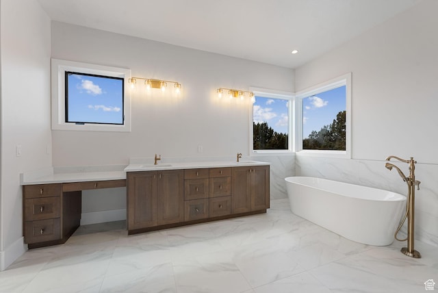 3097 E Corral Peak Cir Unit 145, Heber City, UT 84032 - full bath with a soaking tub, marble finish floor, a sink, and recessed lighting