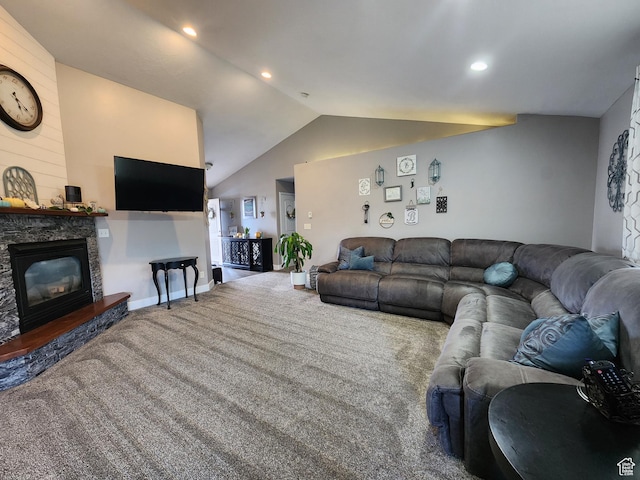 carpeted living room featuring a fireplace and lofted ceiling