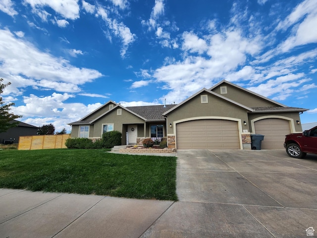 view of front facade with a front yard and a garage