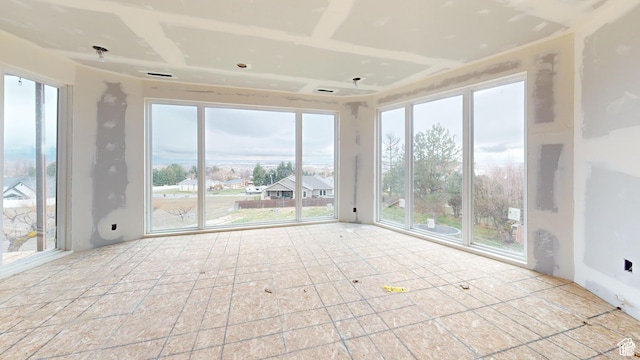 unfurnished sunroom featuring a healthy amount of sunlight