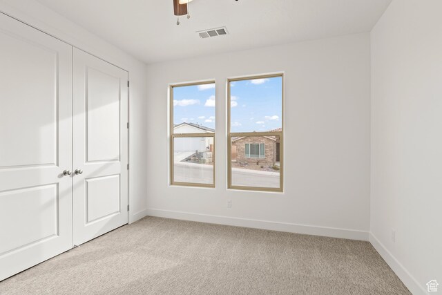 3594 W 185 N, Hurricane, UT 84737 - unfurnished bedroom with ceiling fan, a closet, and light colored carpet